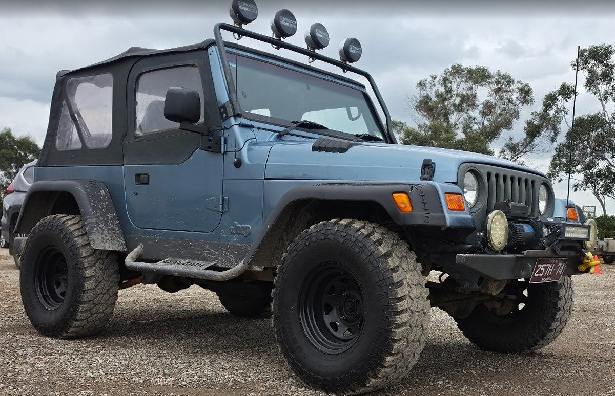 Blue lifted Jeep Wrangler TJ