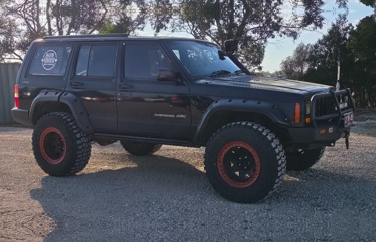Black lifted Jeep Cherokee XJ
